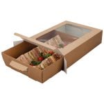 Kraft medium platter box with window. Open and filled with range of triangular cut sandwiches and salad.