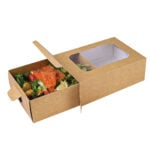 Extra small kraft platter box with clear window sleeve, filled with smoked salmon, sliced avocado, red and yellow tomatoes, salad leaves and a lemon wedge, half out of sleeve.