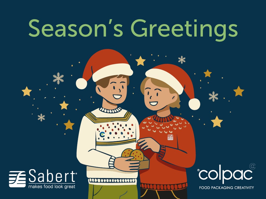 Green Seasons Greetings text on dark blue background. Cartoon people in Christmas jumpers and sharing a box of cookies.