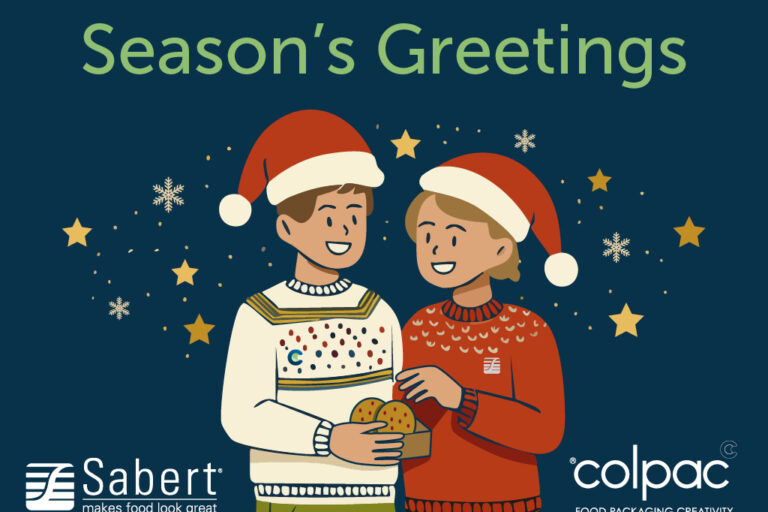 Green Seasons Greetings text on dark blue background. Cartoon people in Christmas jumpers and sharing a box of cookies.